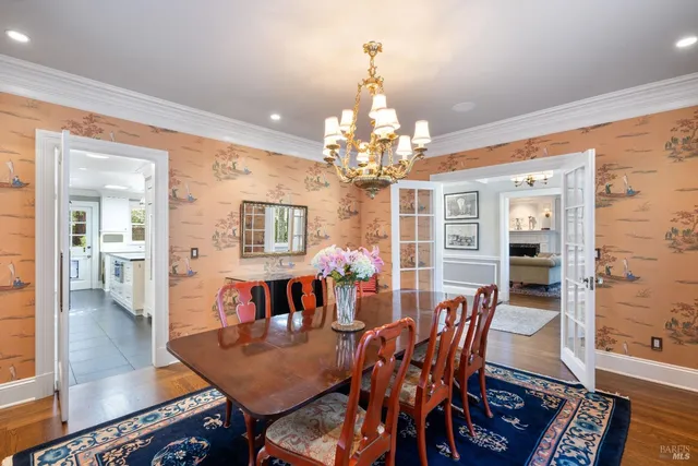 a bathroom with a granite countertop toilet sink and mirror