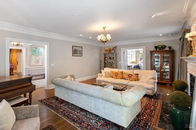 a room with furniture a rug and a book shelf