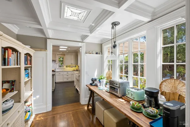 a bathroom with a sink mirror and a shower