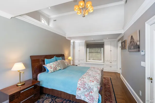 a bathroom with a shower curtain a sink and a large mirror