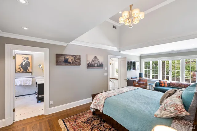 a bedroom with a large bed and a window