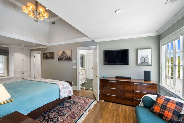 a view of an entryway with wooden floor and a living room