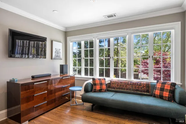 a patio with a table and chairs under an umbrella