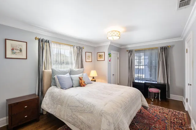 a view of a patio with table and chairs and potted plants