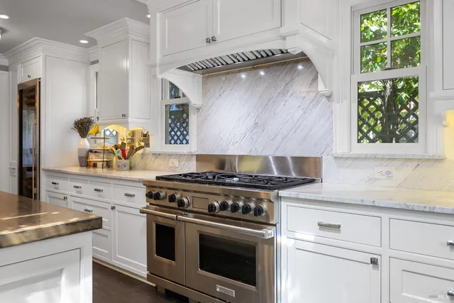 an aerial view of a house with swimming pool garden and patio