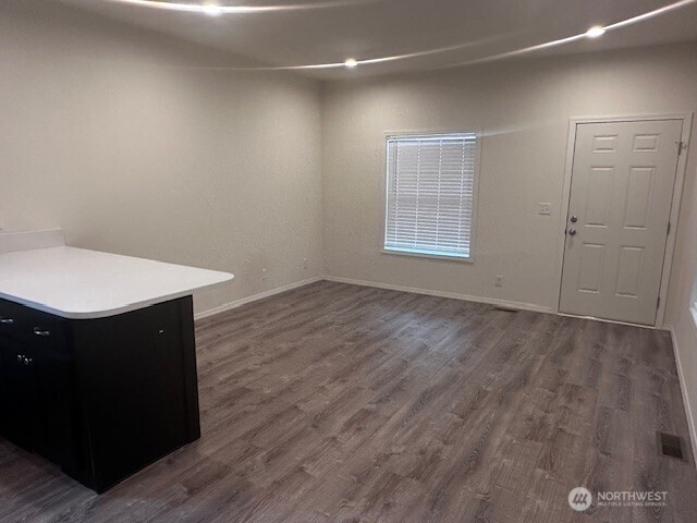 2101 South 324th Street, Unit 188 Federal Way, WA 98003 - Photo 2 of 10 a room with wooden floor and window