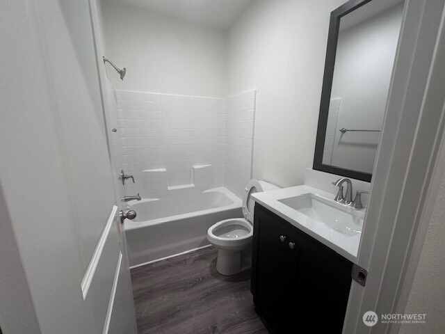 2101 South 324th Street, Unit 188 Federal Way, WA 98003 - Photo 5 of 10 a bathroom with a sink a toilet a mirror and shower