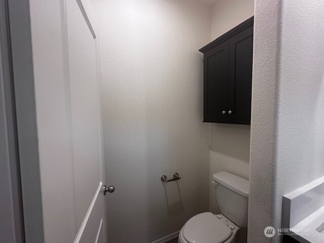 2101 South 324th Street, Unit 188 Federal Way, WA 98003 - Photo 7 of 10 a white toilet sitting next to a shower