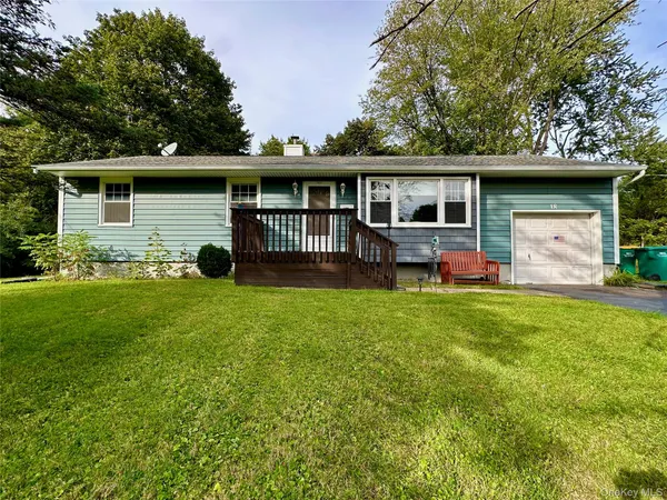 a front view of house with yard and outdoor seating