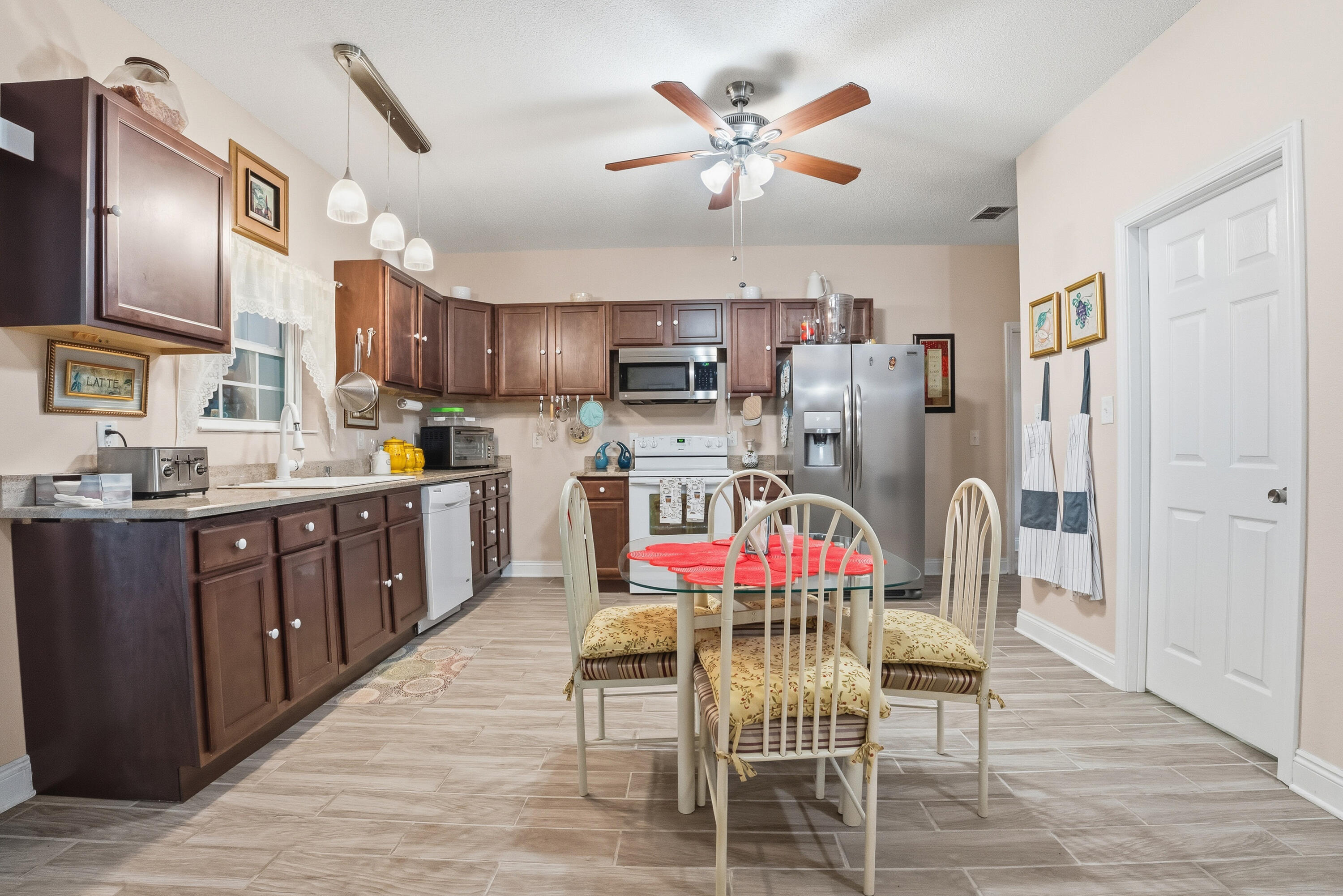 7456 Woodmont Road Navarre, FL 32566 - Photo 40 of 105 Middle kitchen and dining