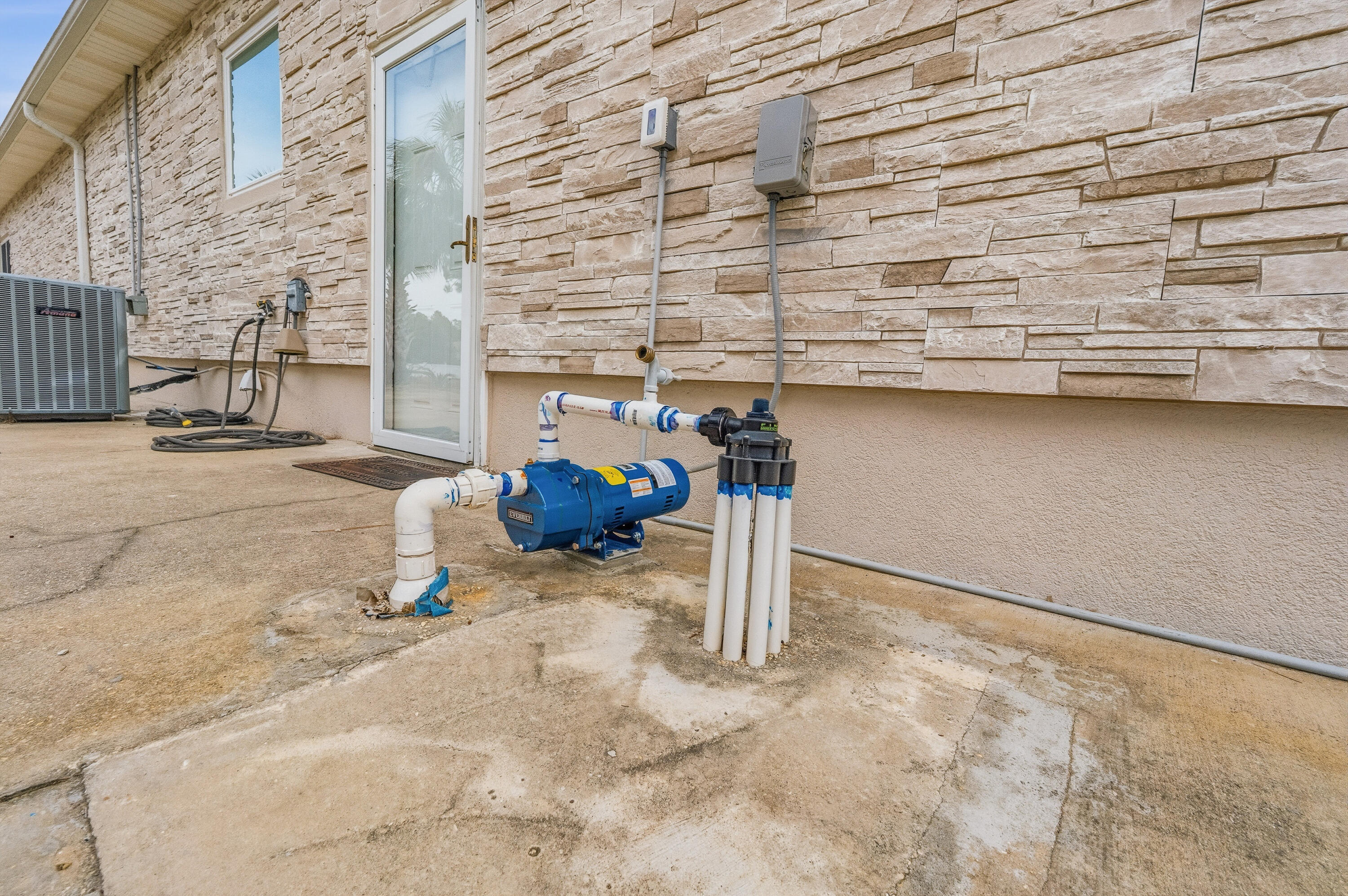 7456 Woodmont Road Navarre, FL 32566 - Photo 88 of 105 Sprinkler pump