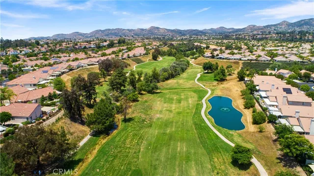 an aerial view of residential houses with outdoor space and river