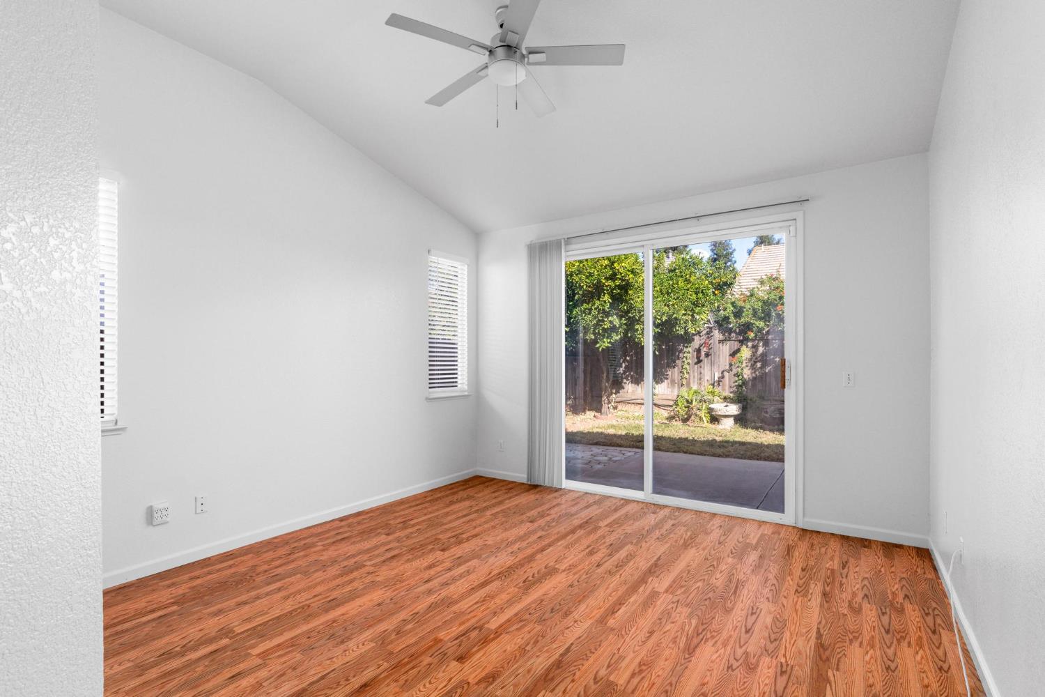 1833 Rail Street Manteca, CA 95337 - Photo 17 of 40 wooden floor in an empty room with a window