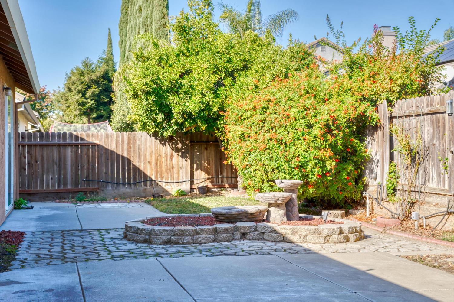 1833 Rail Street Manteca, CA 95337 - Photo 30 of 40 a view of a backyard with plants and wooden fence