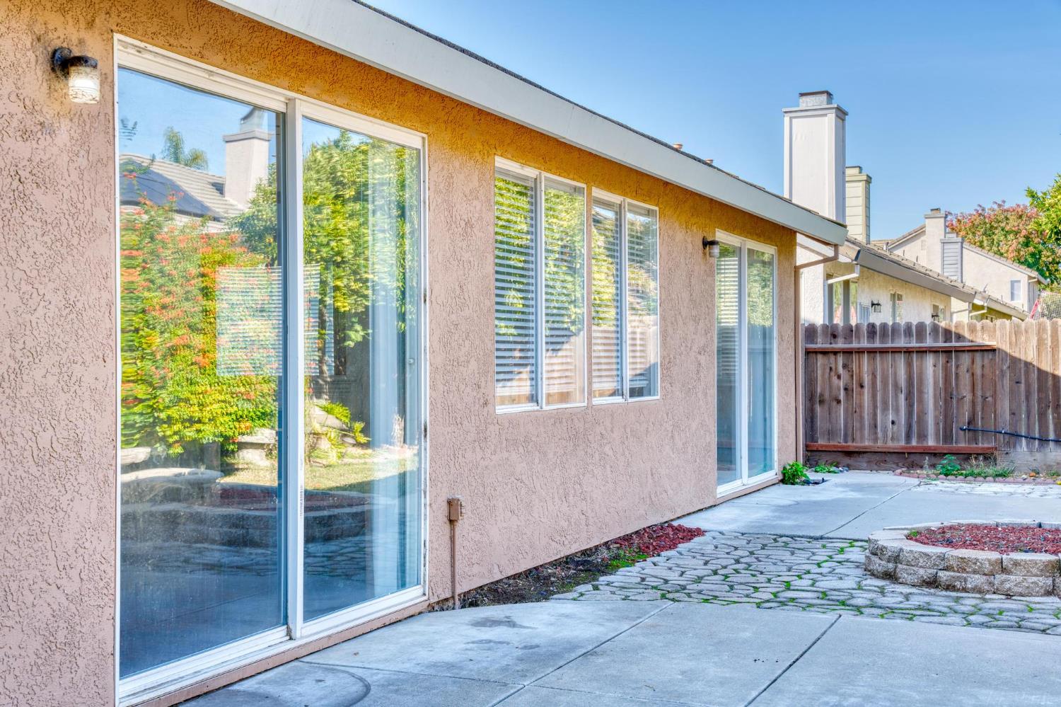 1833 Rail Street Manteca, CA 95337 - Photo 31 of 40 a front view of a house with a garden