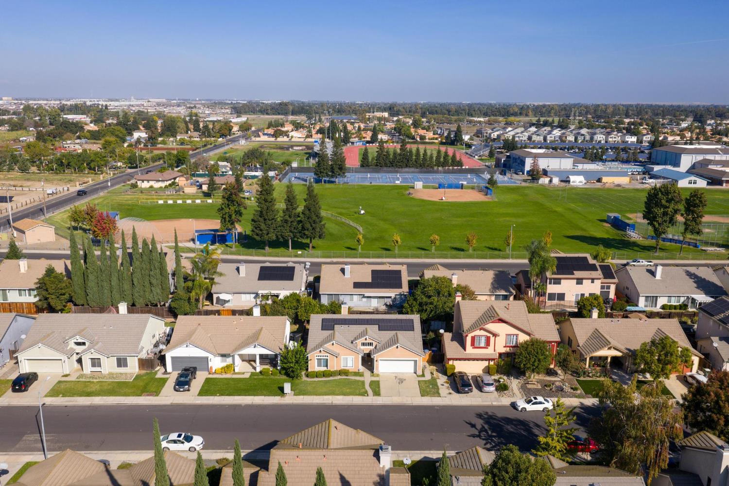 1833 Rail Street Manteca, CA 95337 - Photo 40 of 40 an aerial view of a city with lots of residential buildings ocean and mountain view in back