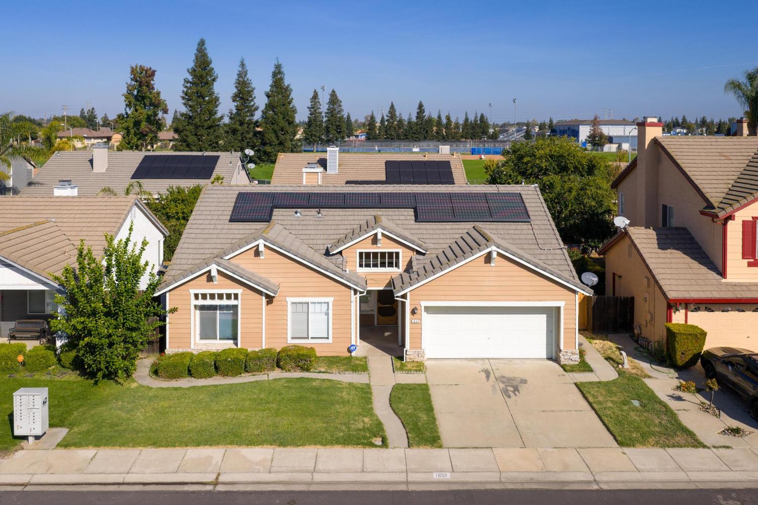 1833 Rail Street Manteca, CA 95337 - Photo 4 of 40 a view of multiple houses with a yard