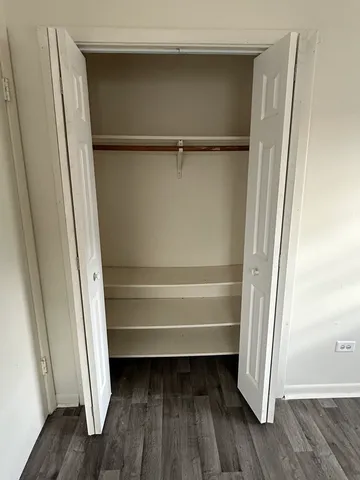 a view of closet area with empty racks