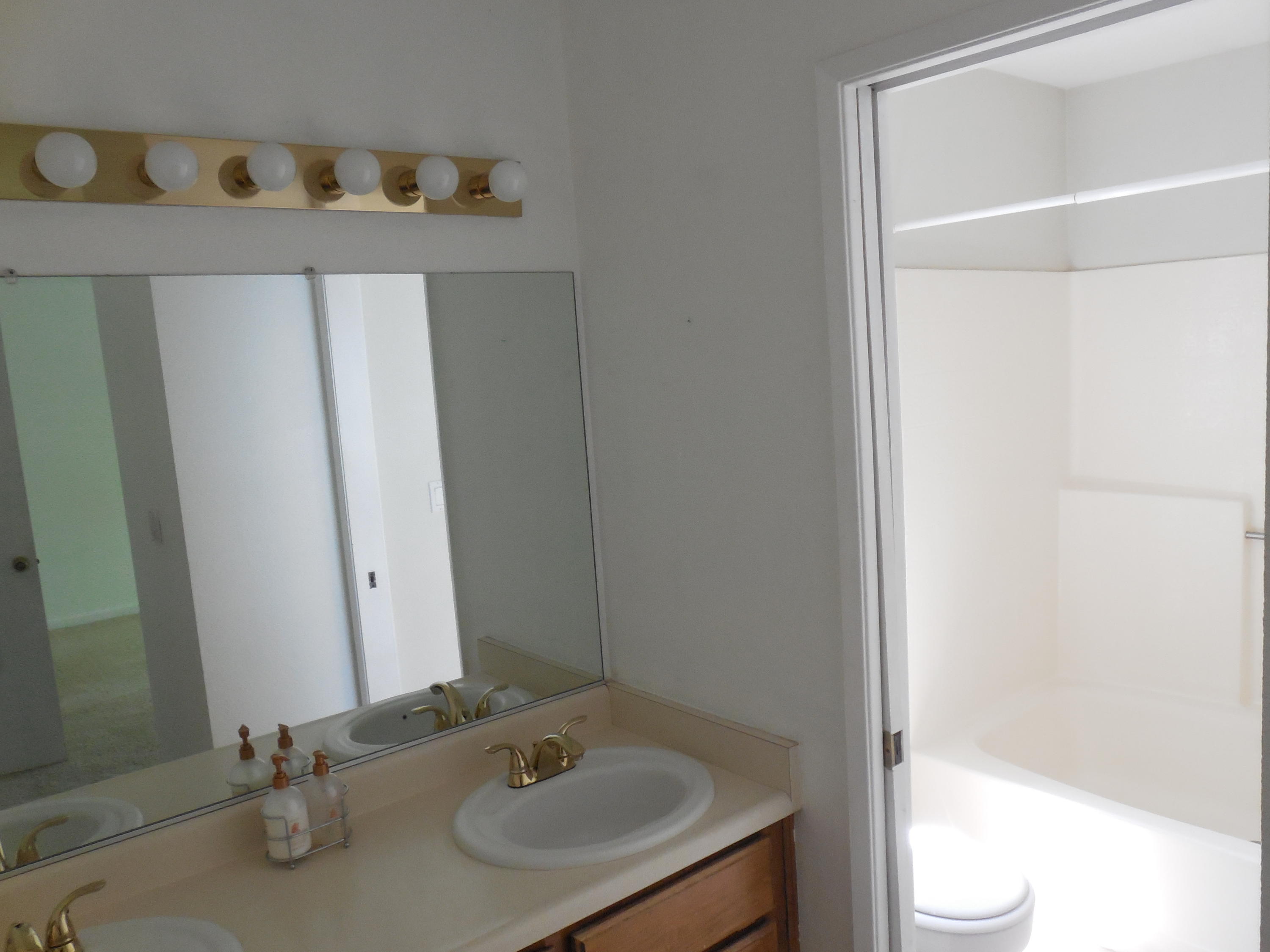 3654 Santa Rosa Way Redding, CA 96003 - Photo 11 of 16 a bathroom with a sink and a mirror