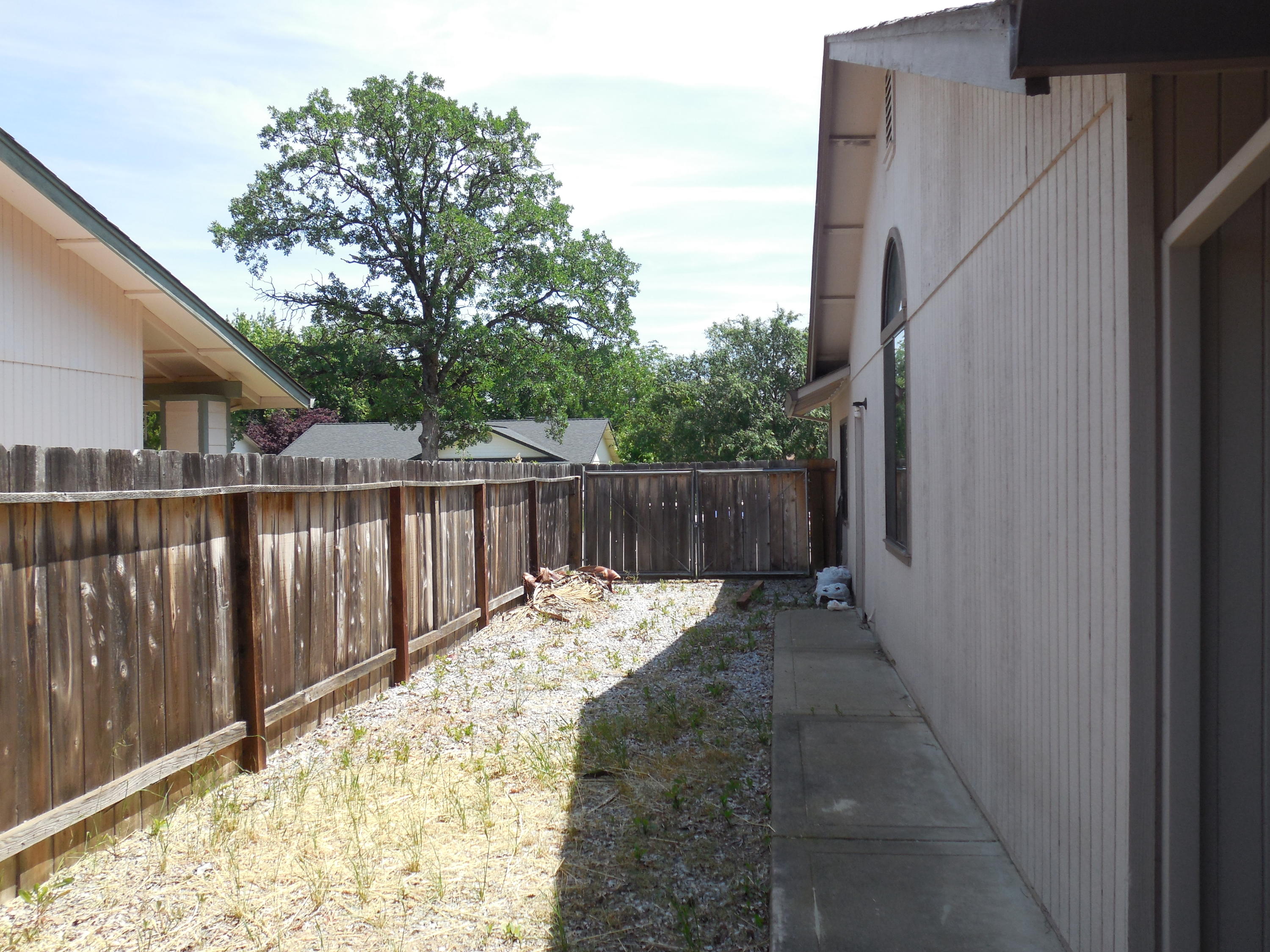 3654 Santa Rosa Way Redding, CA 96003 - Photo 14 of 16 a view of backyard with wooden fence