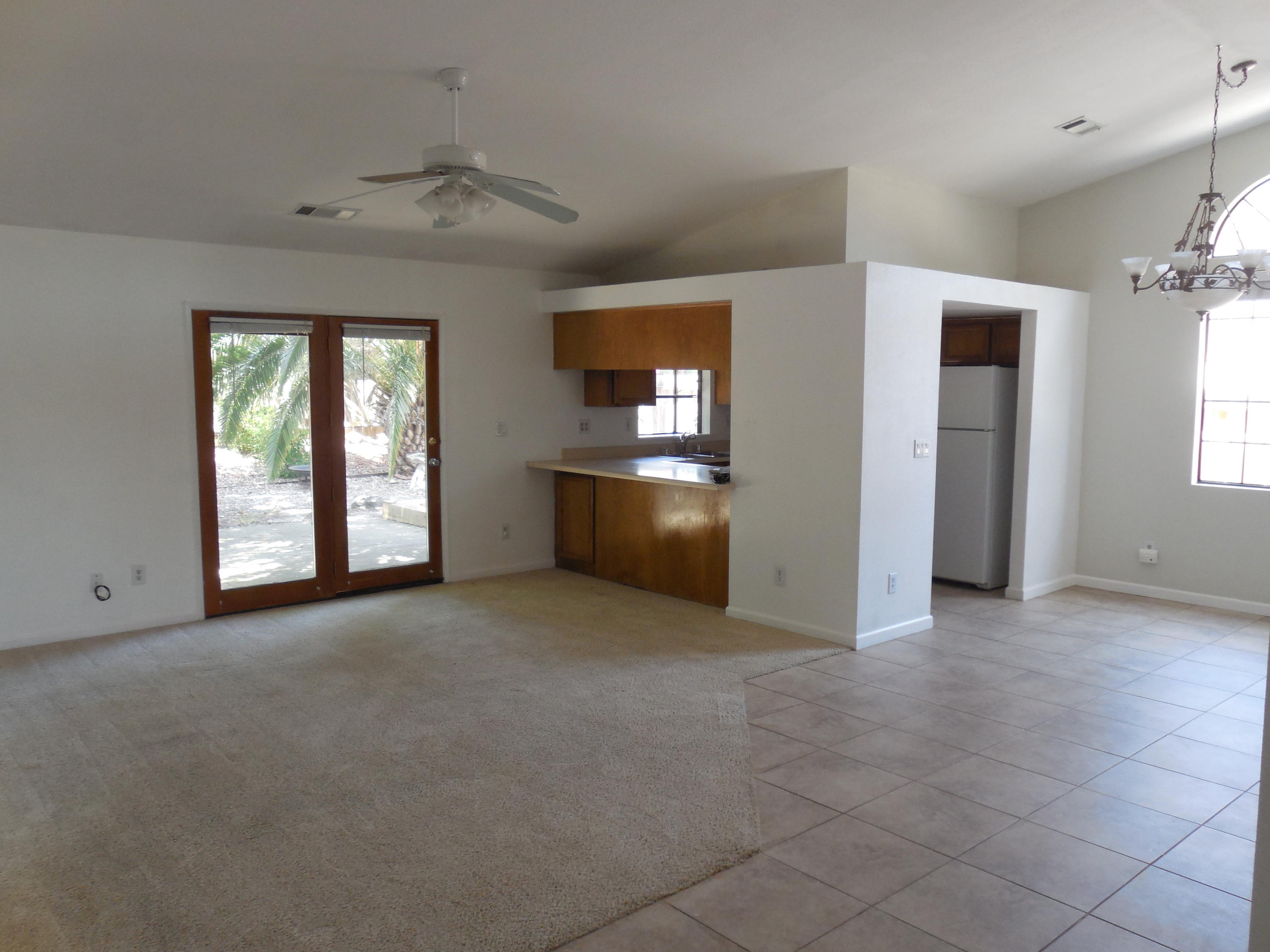 3654 Santa Rosa Way Redding, CA 96003 - Photo 5 of 16 an empty room with windows and fireplace