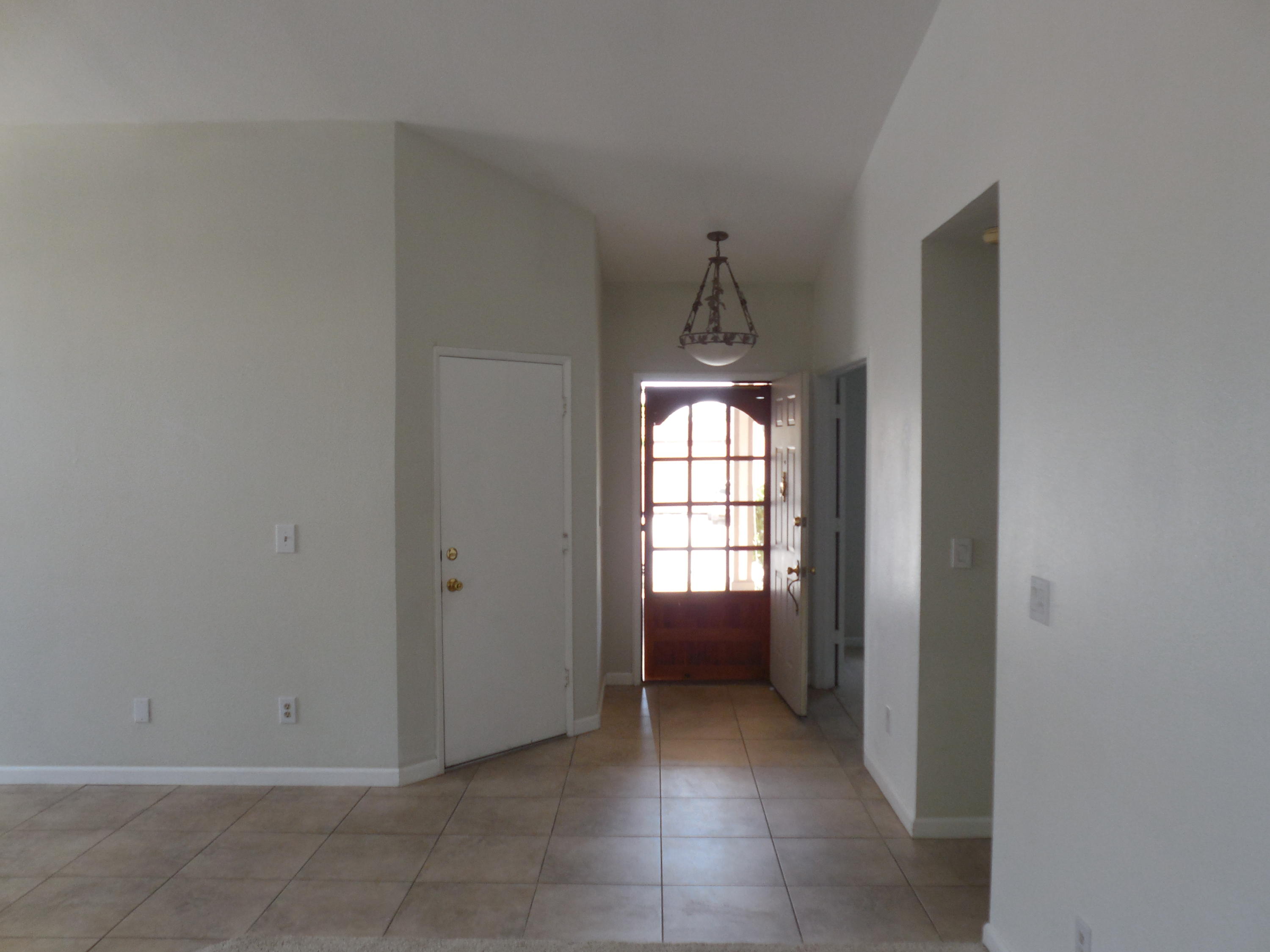 3654 Santa Rosa Way Redding, CA 96003 - Photo 7 of 16 a view of a hallway with wooden floor and a sink