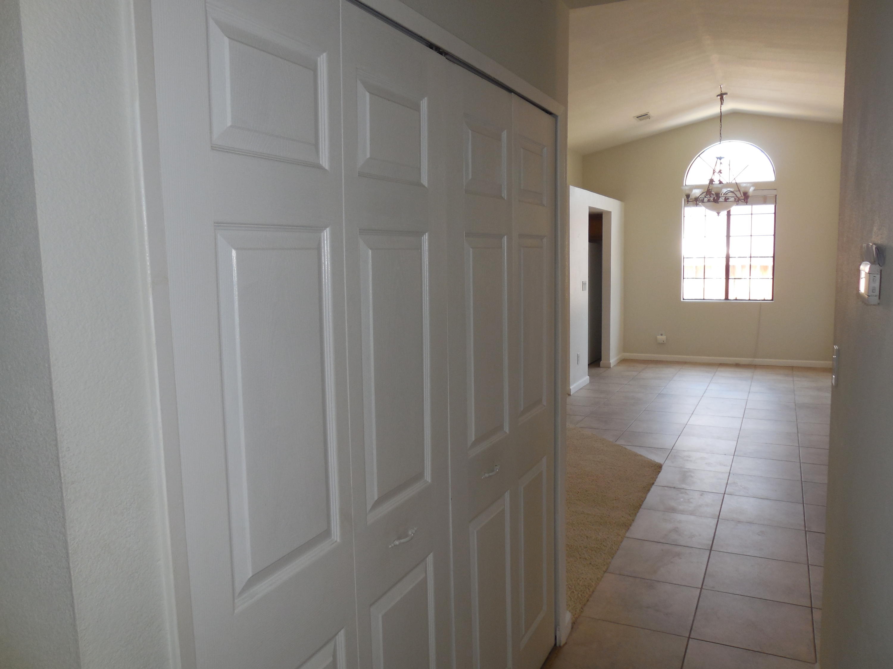 3654 Santa Rosa Way Redding, CA 96003 - Photo 8 of 16 a view of a hallway with windows and chandelier
