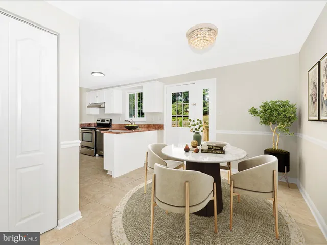 a dining room with furniture and window