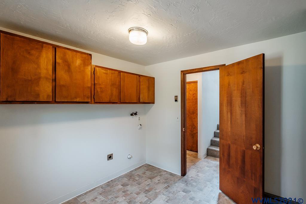 1278 Southwest Maple Street Dallas, OR 97338 - Photo 31 of 42 a view of a room with wooden floor and cabinet