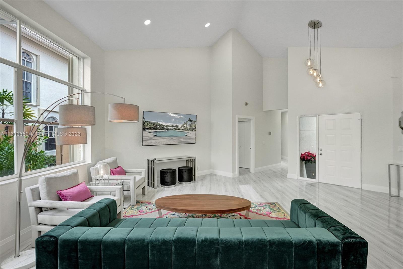 6688 Northwest 25th Court Boca Raton, FL 33496 - Photo 13 of 64 a patio with a table and chairs