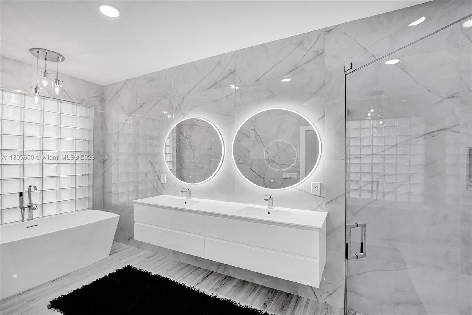 6688 Northwest 25th Court Boca Raton, FL 33496 - Photo 18 of 64 a bathroom with a sink a toilet and shower