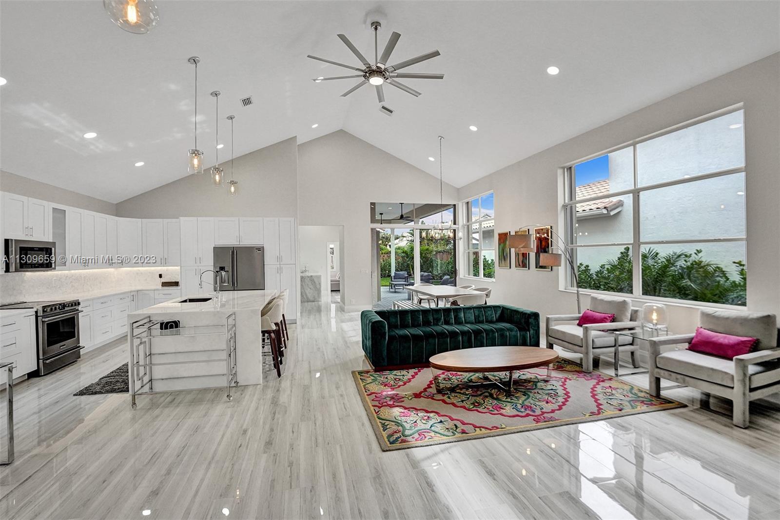 6688 Northwest 25th Court Boca Raton, FL 33496 - Photo 2 of 64 a living room with furniture fireplace and window