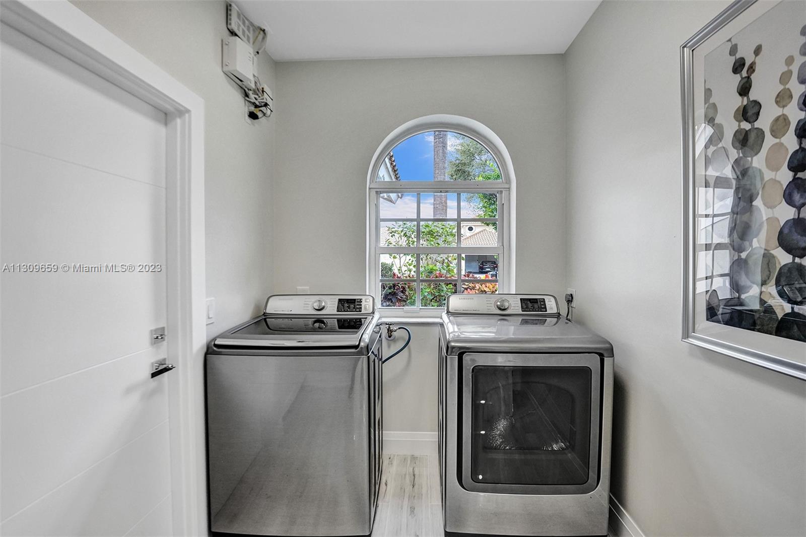 6688 Northwest 25th Court Boca Raton, FL 33496 - Photo 36 of 64 a kitchen with a stove and a sink