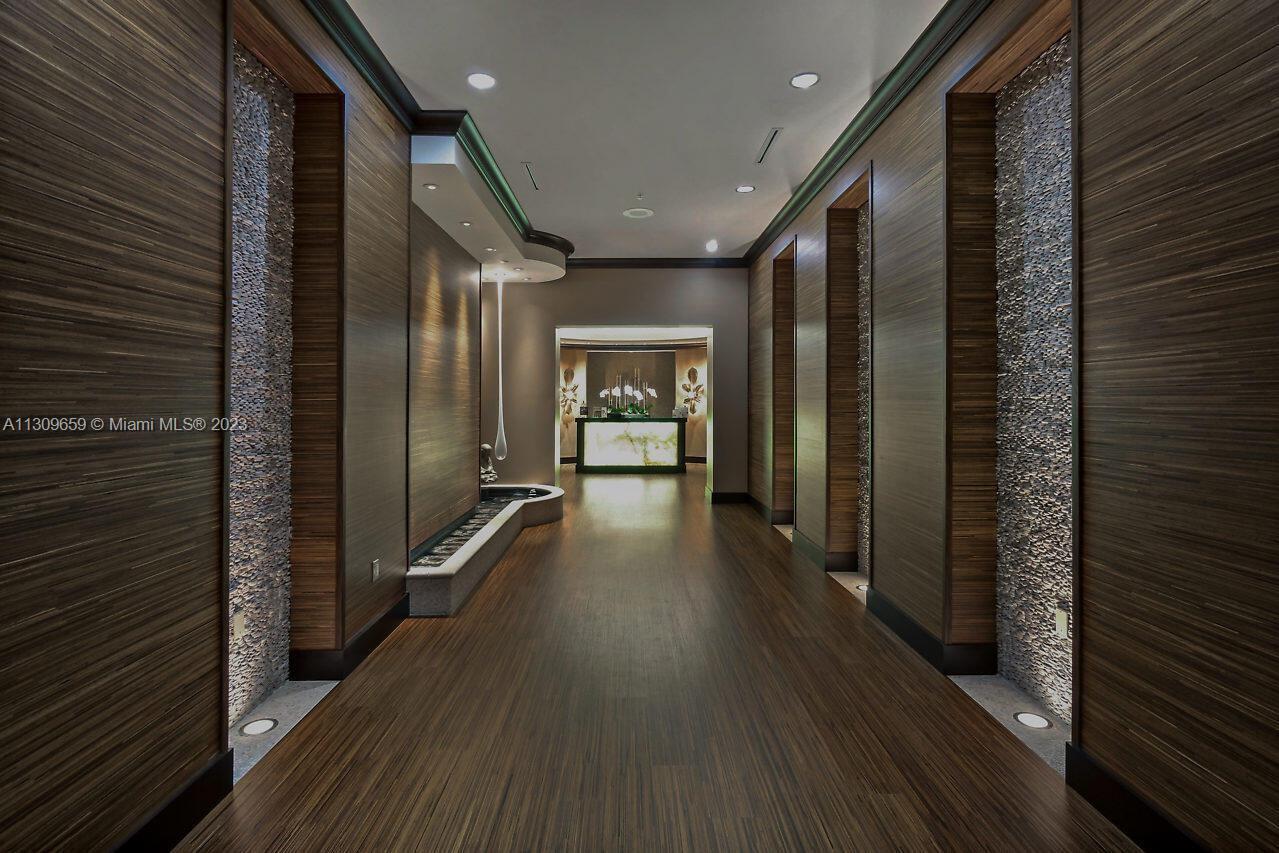 6688 Northwest 25th Court Boca Raton, FL 33496 - Photo 61 of 64 a view of a hallway with wooden floor