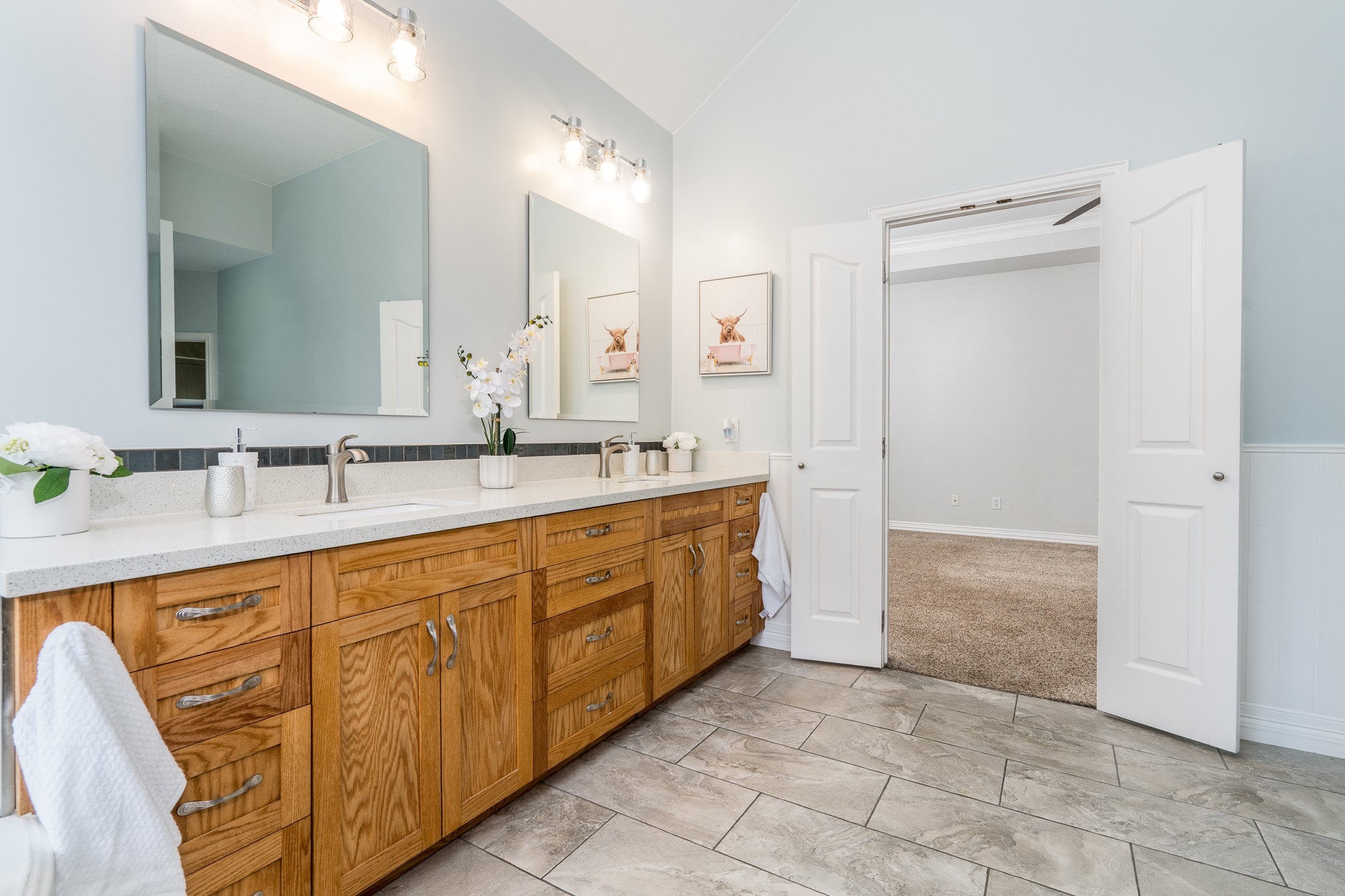 5914 Oakmoss Trail Spring, TX 77379 - Photo 17 of 50 Double sinks and near endless storage keep the spa-like primary bath a luxurious retreat!