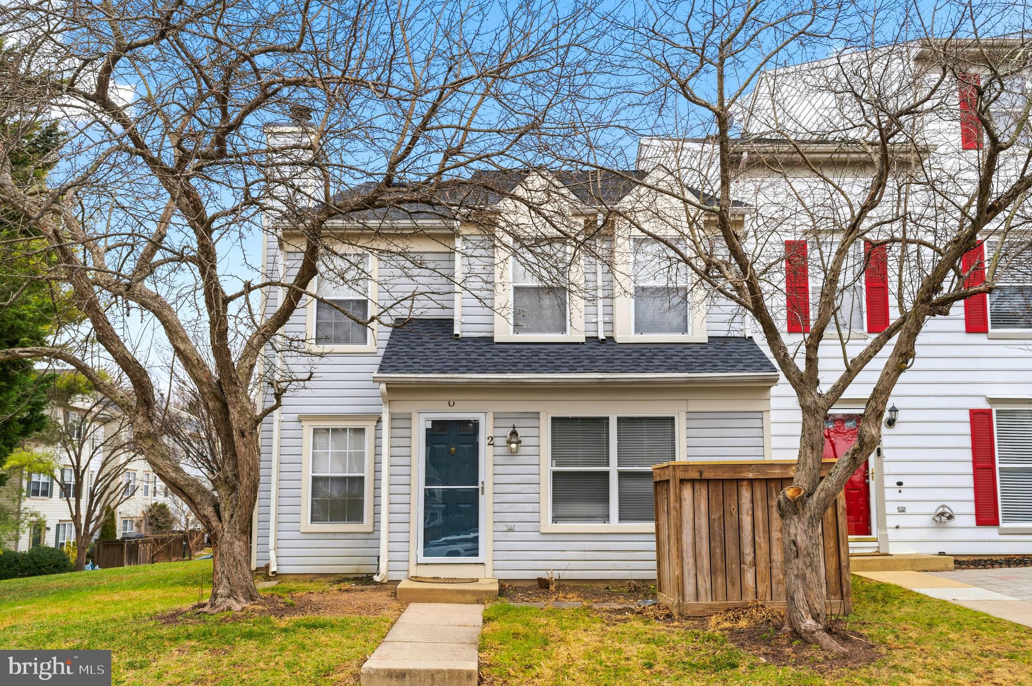 a front view of a house with a yard tree s