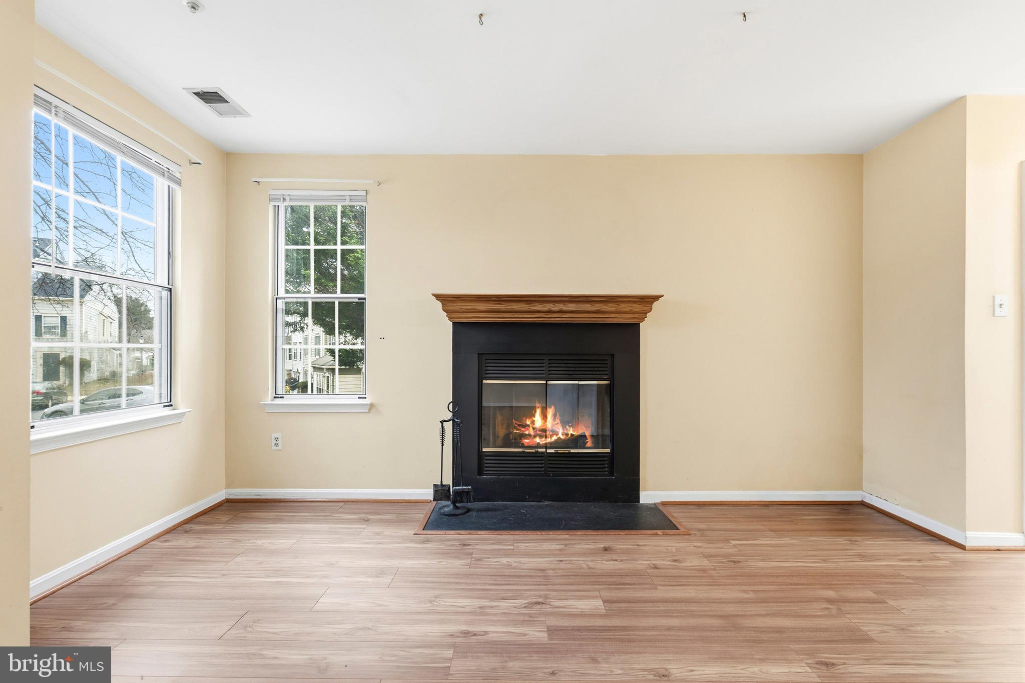 2 Highstream Court, Unit 684 Germantown, MD 20874 - Photo 12 of 25 a view of an empty room with wooden floor and a window