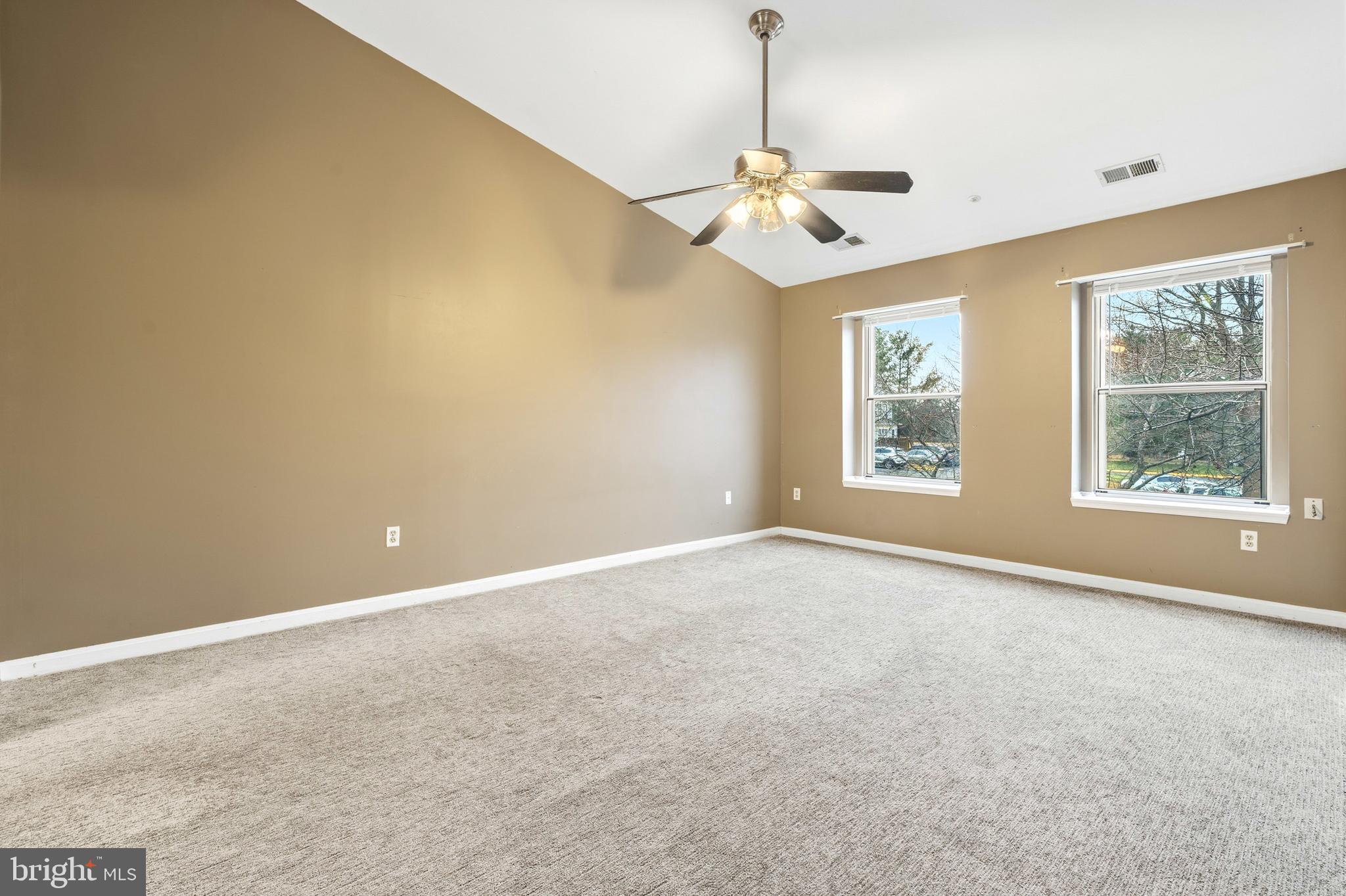 2 Highstream Court, Unit 684 Germantown, MD 20874 - Photo 18 of 25 a view of an empty room with windows