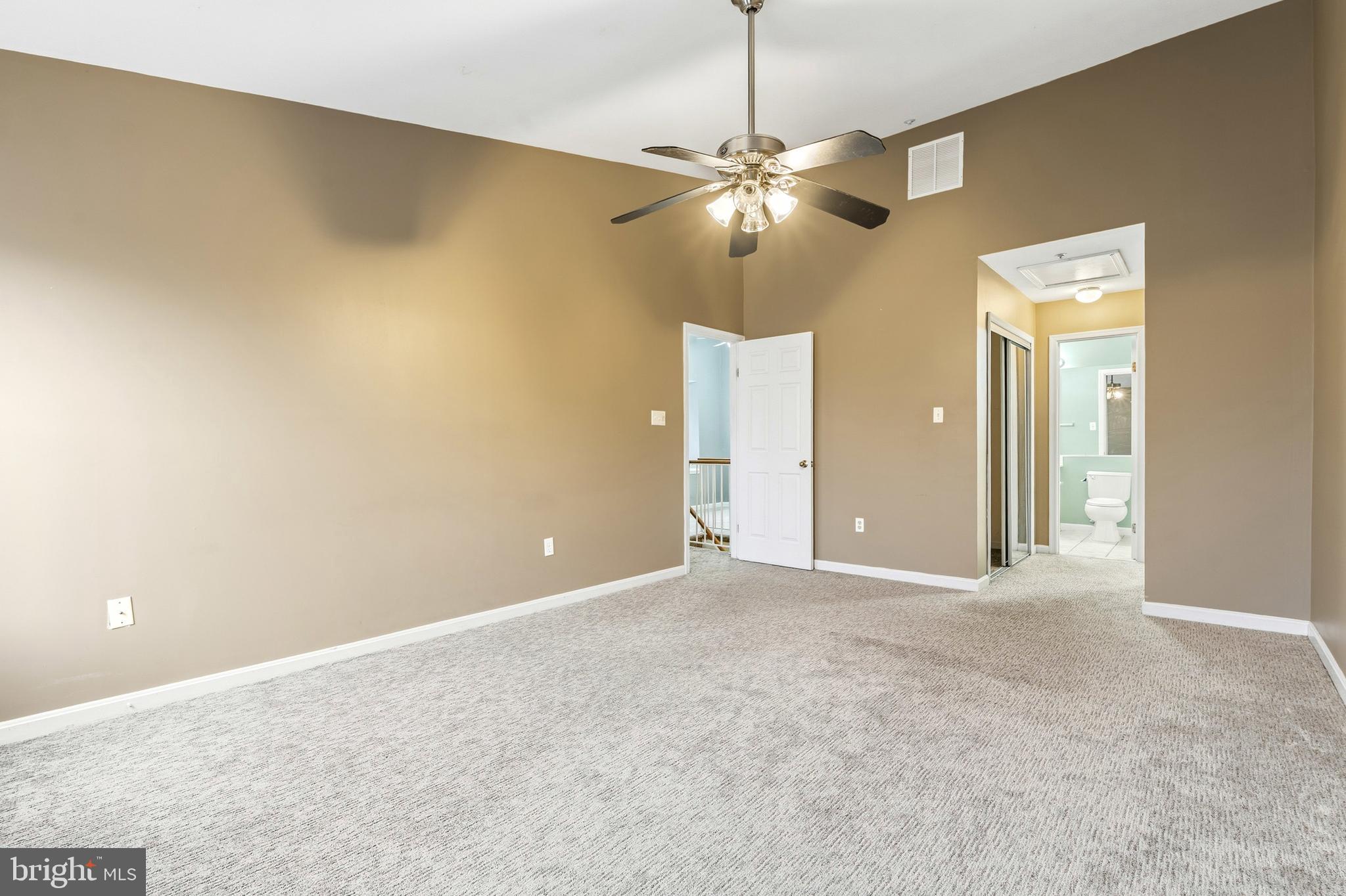 2 Highstream Court, Unit 684 Germantown, MD 20874 - Photo 19 of 25 a view of an empty room with a chandelier fan