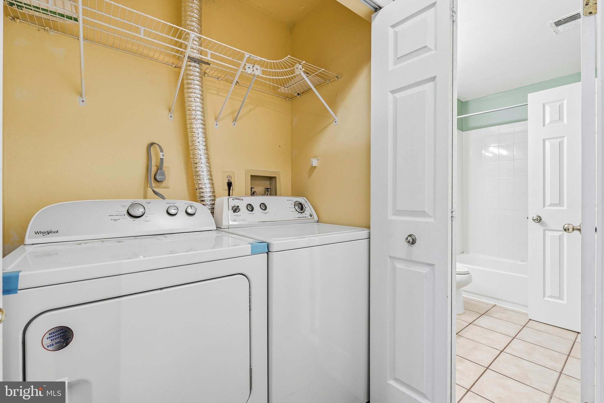 2 Highstream Court, Unit 684 Germantown, MD 20874 - Photo 22 of 25 a utility room with dryer and washer