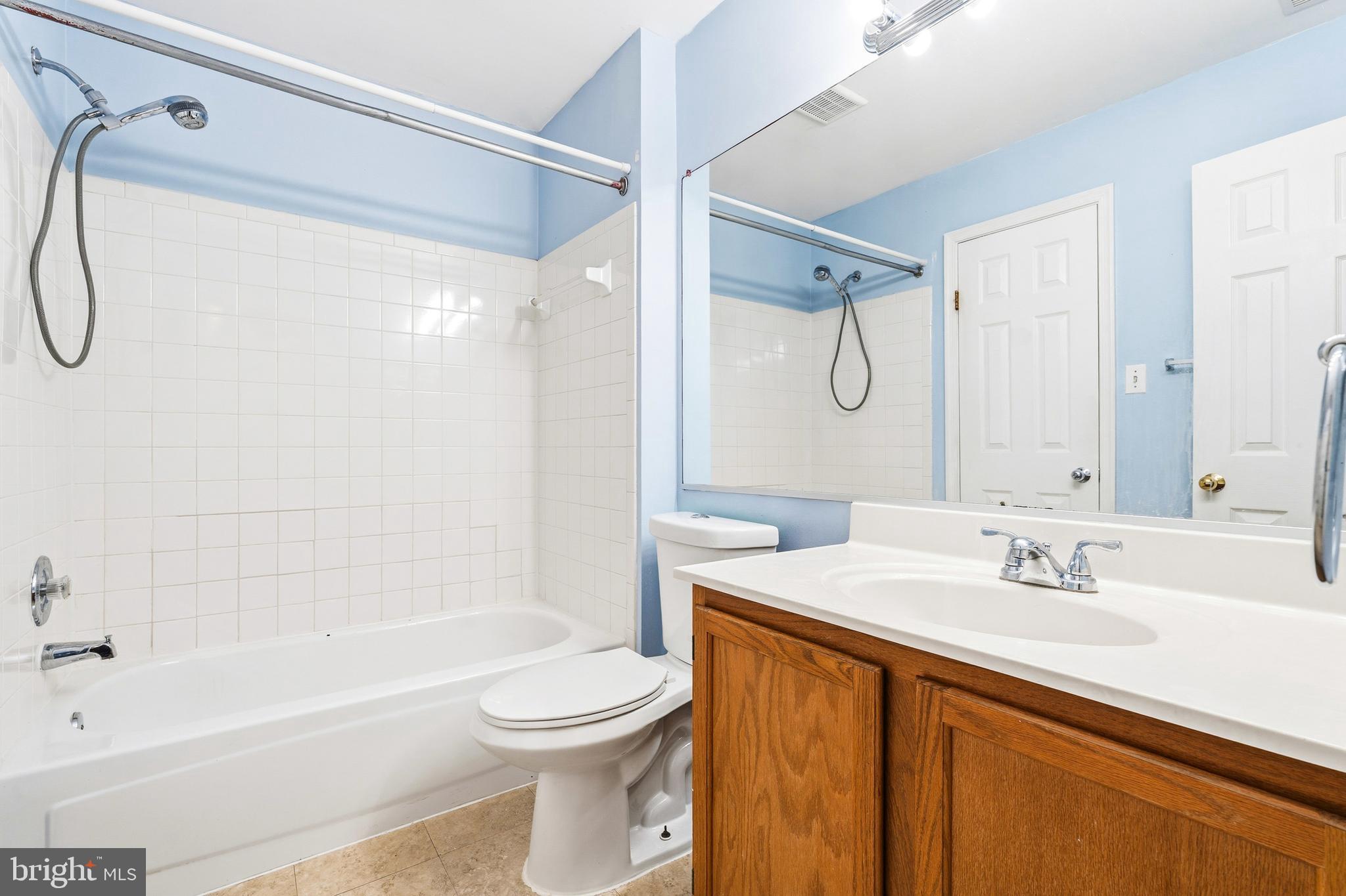 2 Highstream Court, Unit 684 Germantown, MD 20874 - Photo 8 of 25 a bathroom with a sink toilet and shower