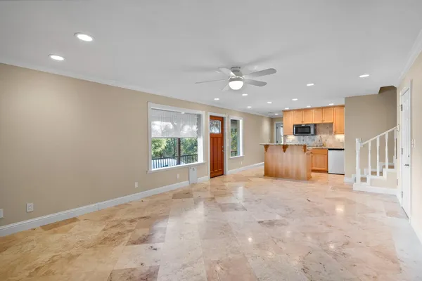 a view of an empty room with a window