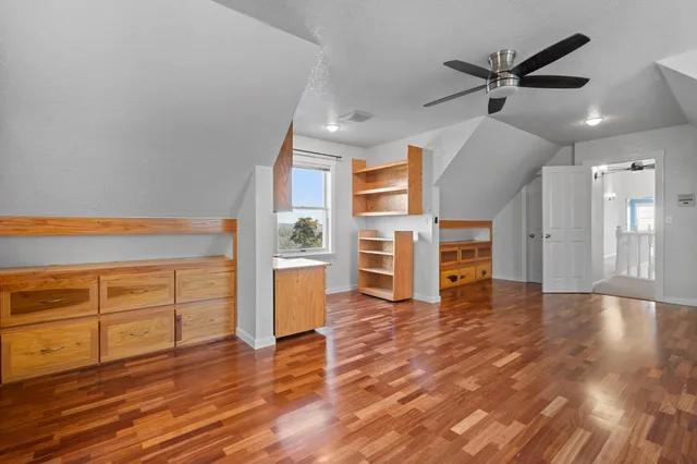 a kitchen with stainless steel appliances granite countertop a sink a stove and microwave