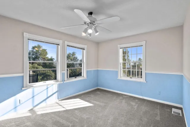 a bathroom with a granite countertop sink a mirror and a bathtub