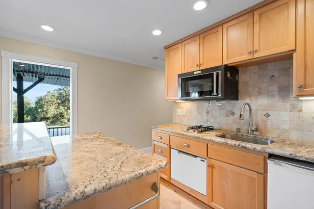 a view of swimming pool with seating area