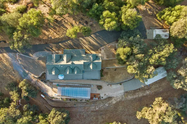 a view of kitchen with stainless steel appliances granite countertop cabinets and a counter top space