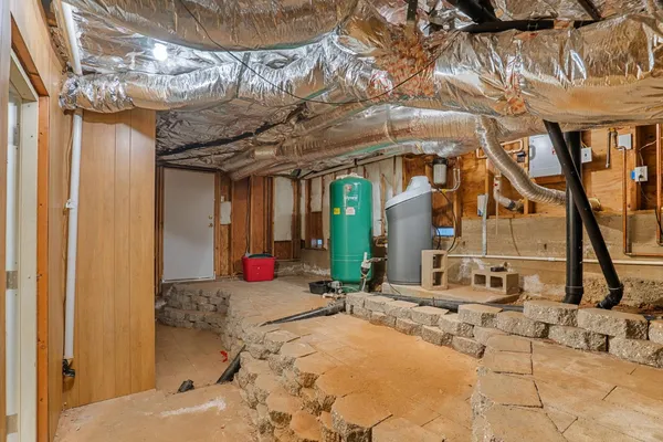 a view of a kitchen with wooden floor and a ceiling fan