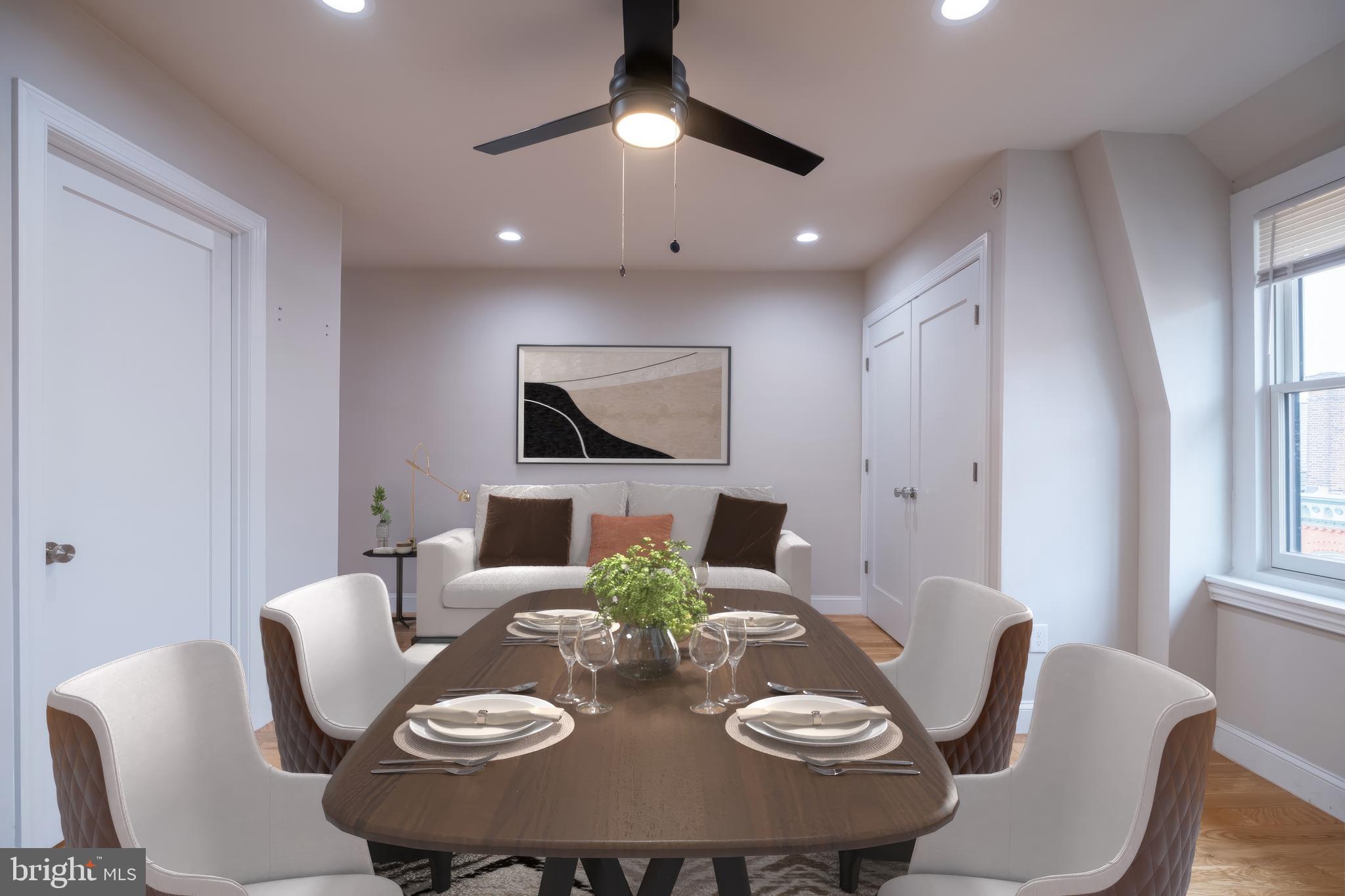 333 South 21st Street, Unit 4 Philadelphia, PA 19103 - Photo 2 of 15 a view of a dining room with furniture a chandelier and wooden floor