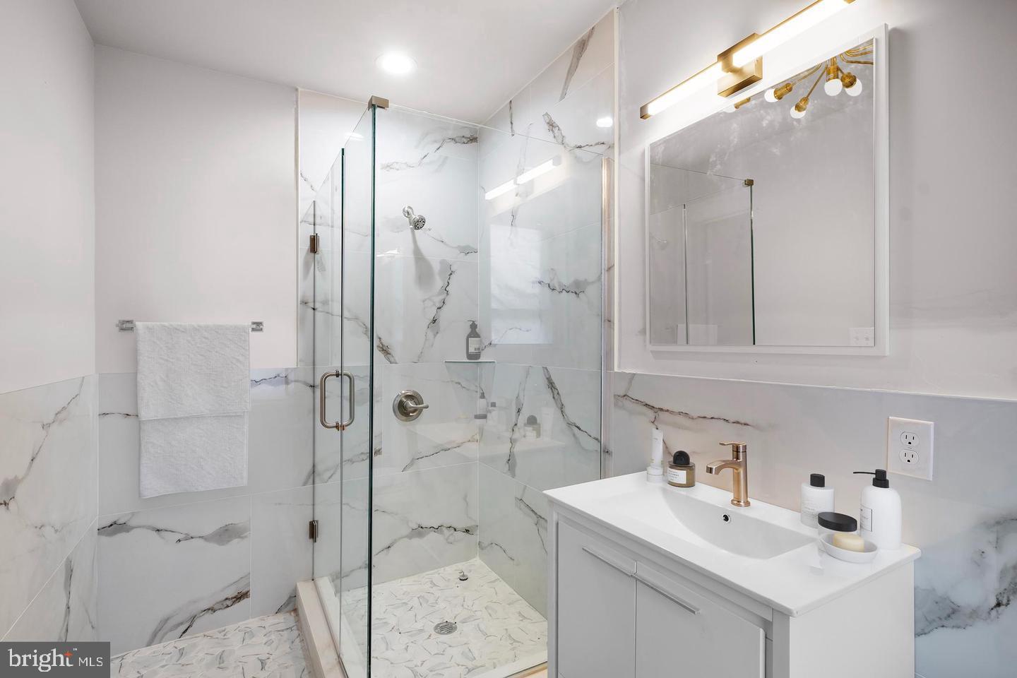 333 South 21st Street, Unit 4 Philadelphia, PA 19103 - Photo 9 of 15 a bathroom with a sink vanity toilet and shower
