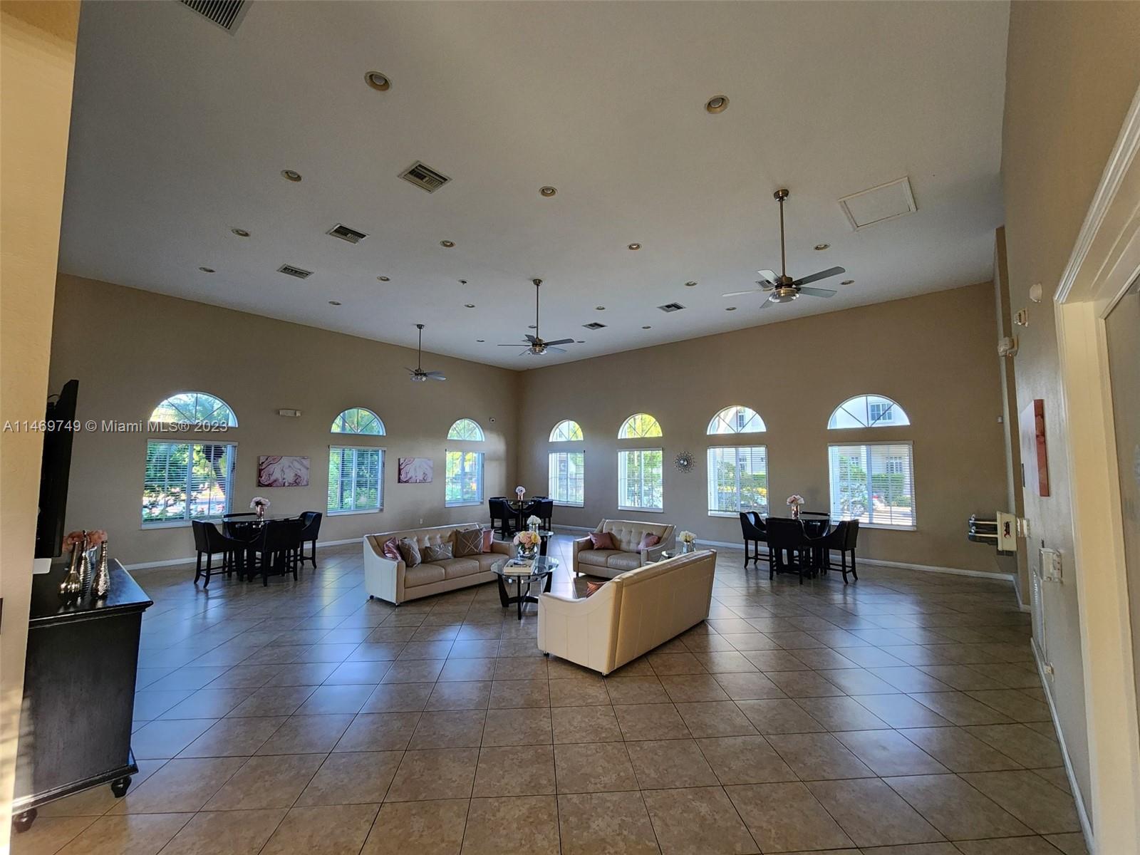 13986 Southwest 276th Street Homestead, FL 33032 - Photo 18 of 28 a living room with furniture and large windows